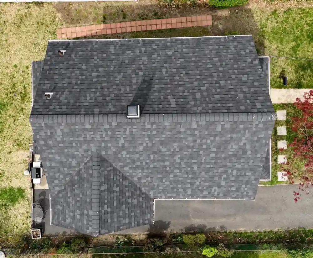 Steep gabled roof with gray asphalt shingles and dormers